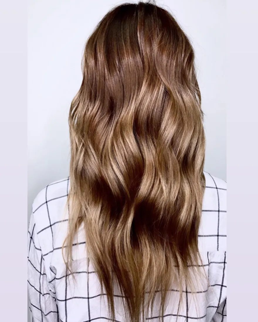 Hand-painted balayage with soft dimension through long waves