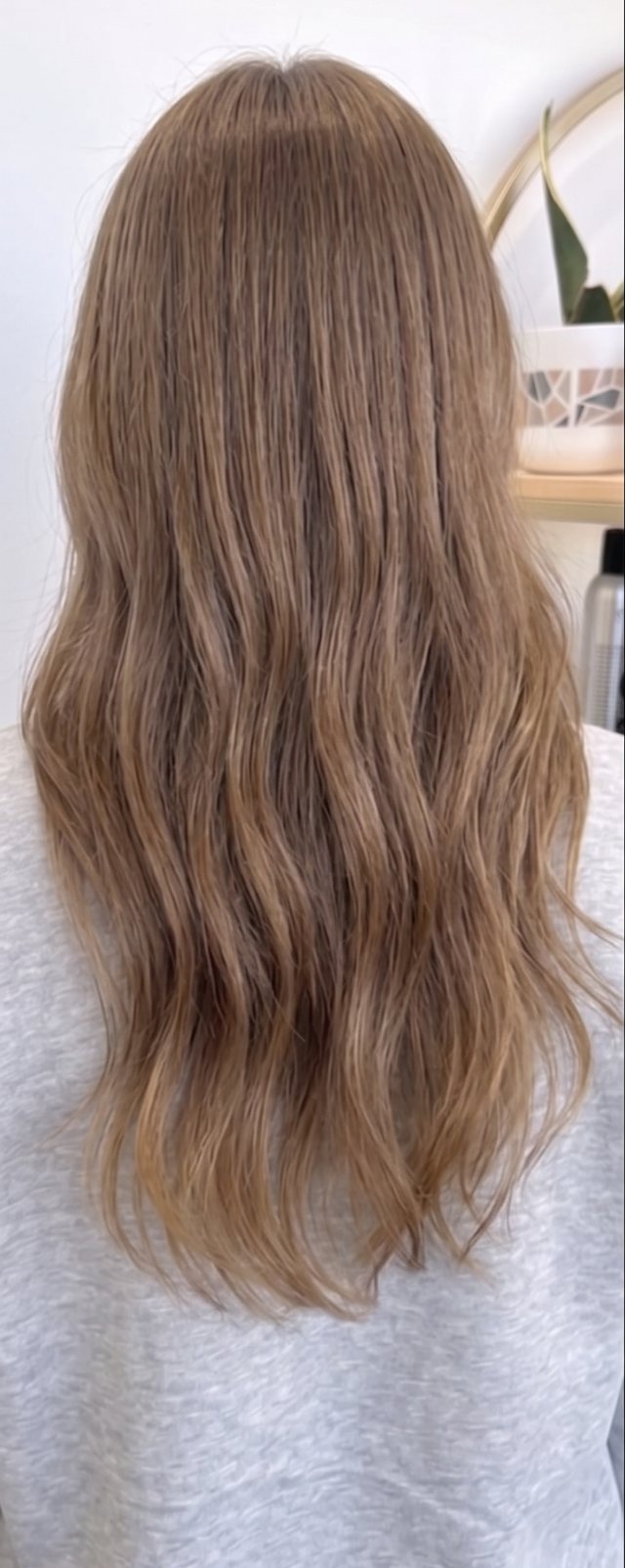 Grown-out dark blonde before a full lightening service
