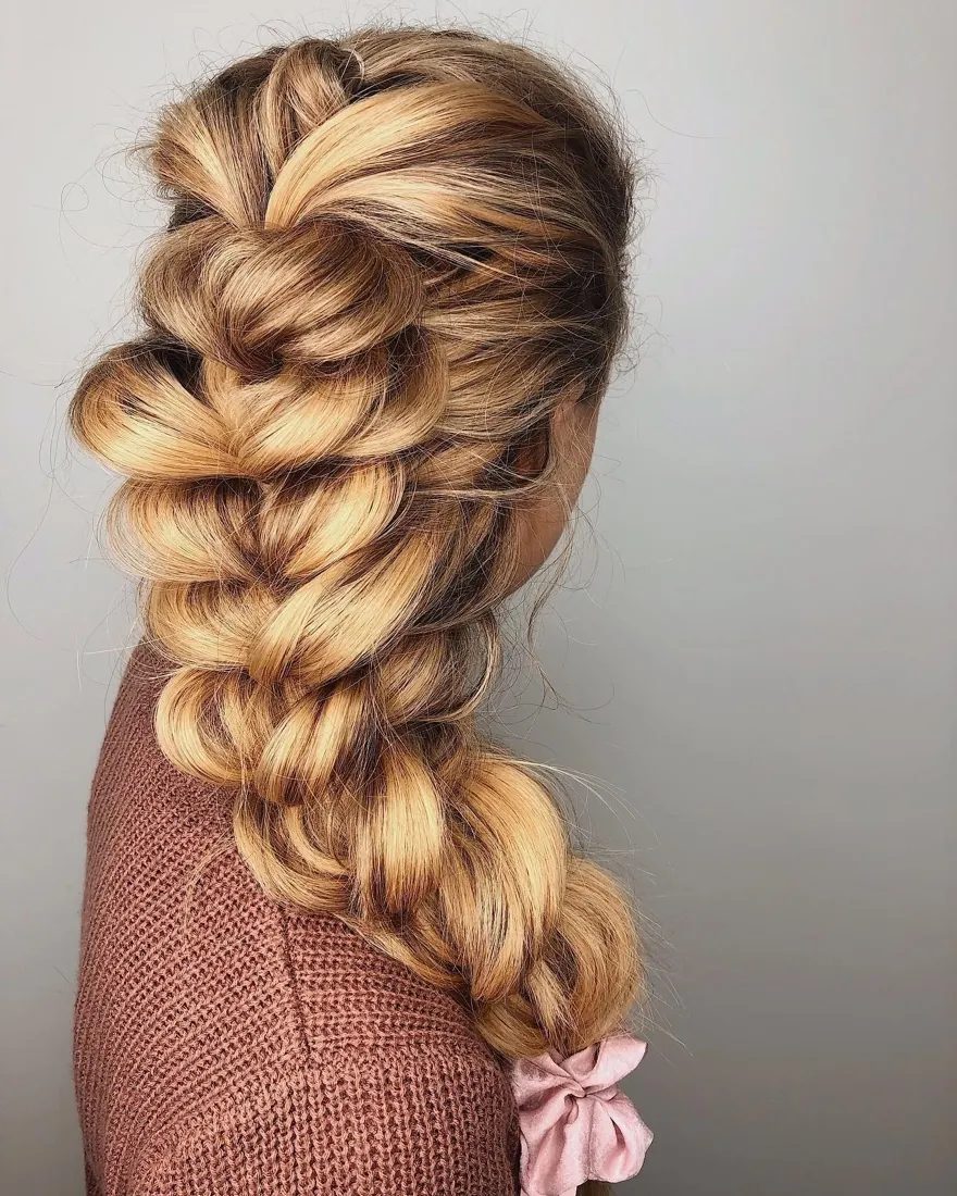 Wedding party styling — a loose fishtail braid dressed with soft face-framing pieces, by Hello Beauty Lounge in Red Deer