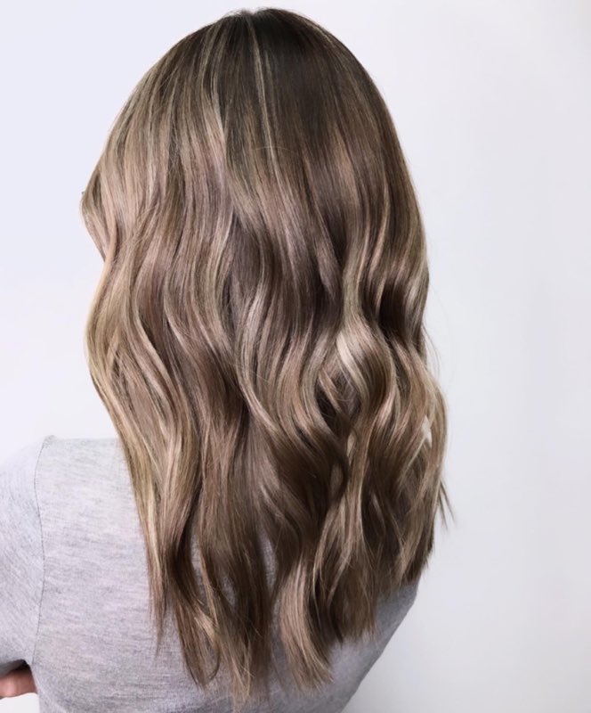 Corrective colour evened out through the lengths into a clean brunette