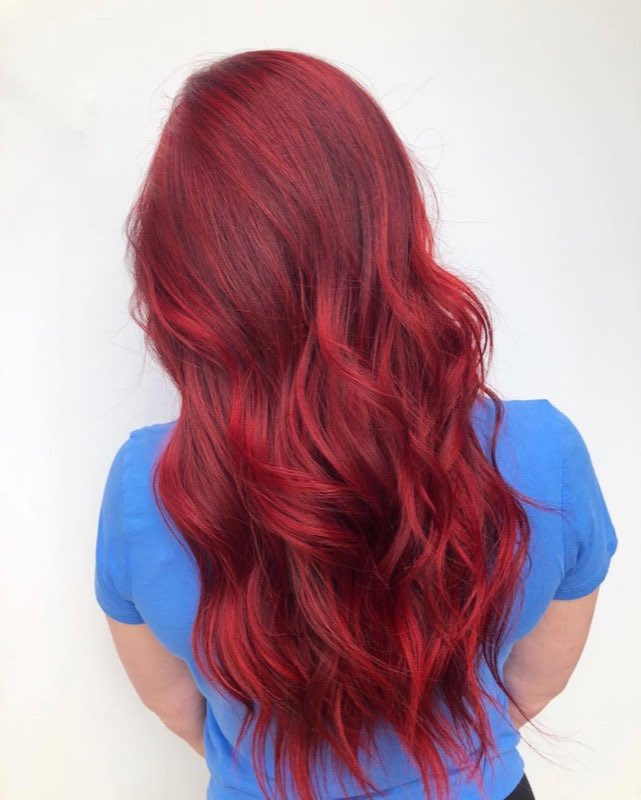 Vivid red corrected to an even, glossy finish from root to tip, by Hello Beauty Lounge in Red Deer