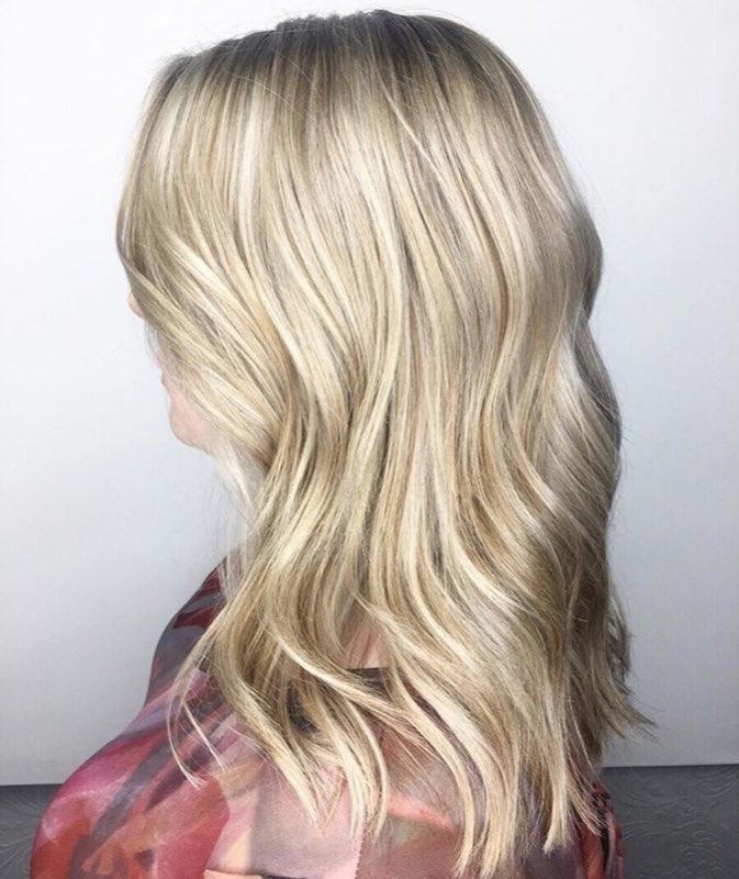 Icy blonde toned cool through the lengths with no brassiness, by Hello Beauty Lounge in Red Deer