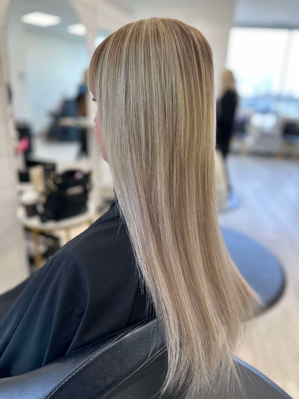 Long blonde balayage seen from the side