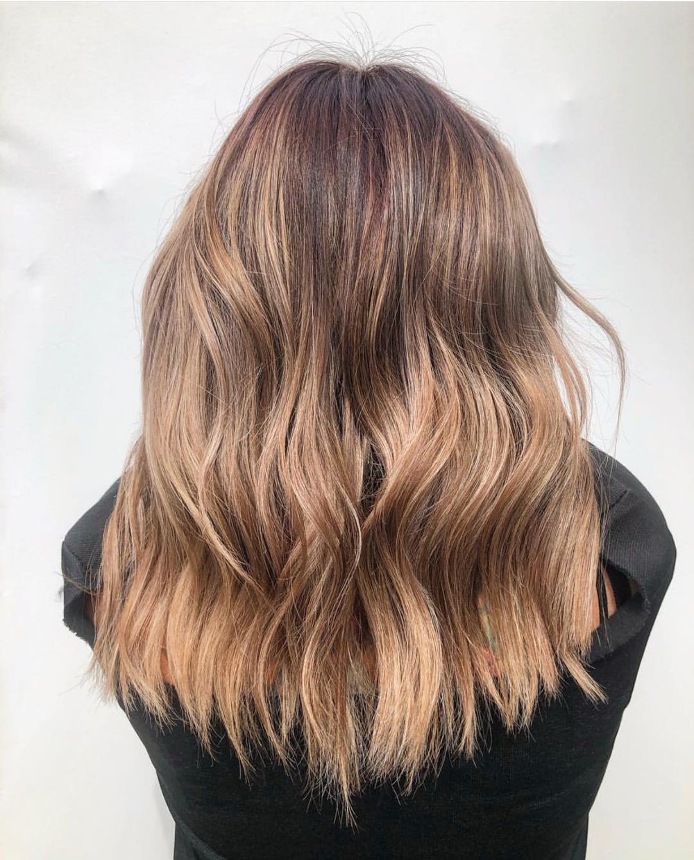 Golden copper balayage through long waves